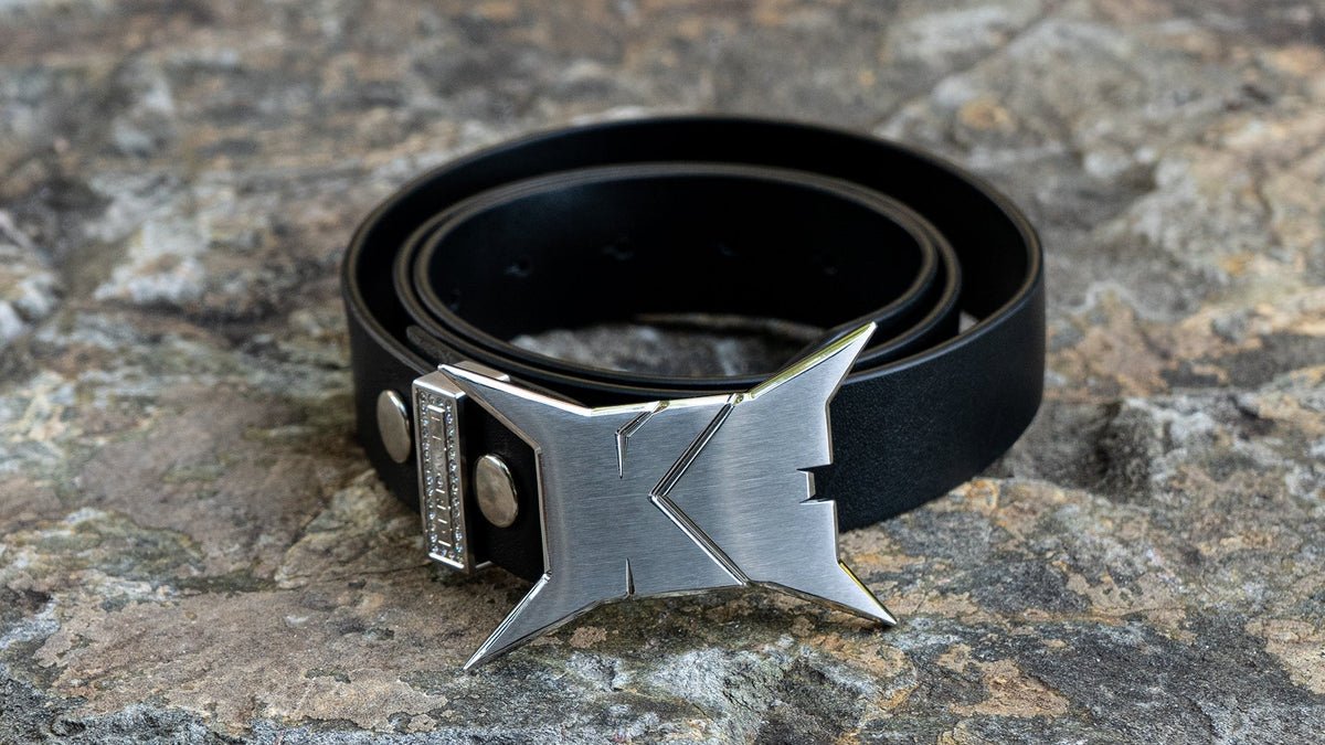 Black belt, with metal logo buckle, and rhinestone belt loop