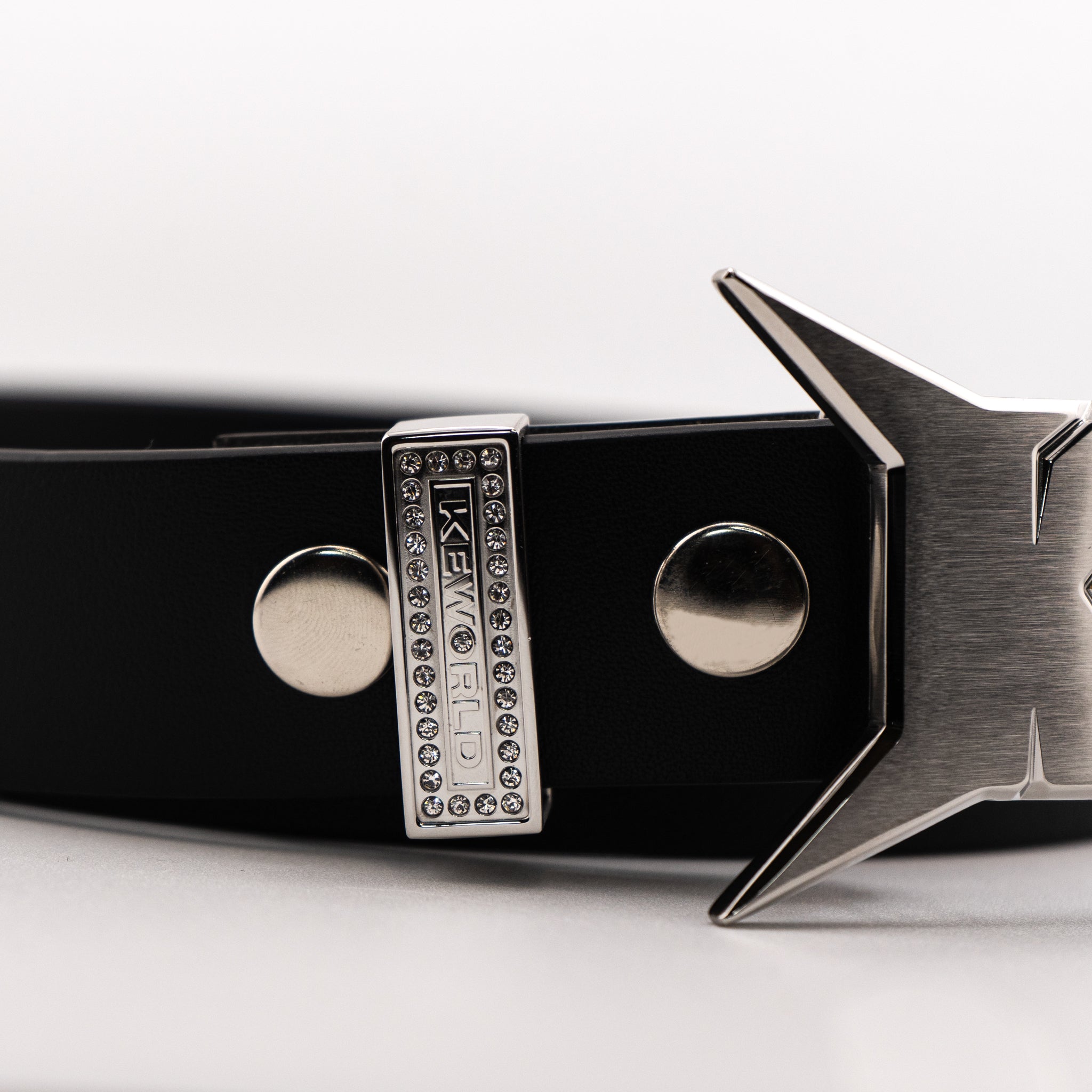 Black belt with silver buckle on a white background