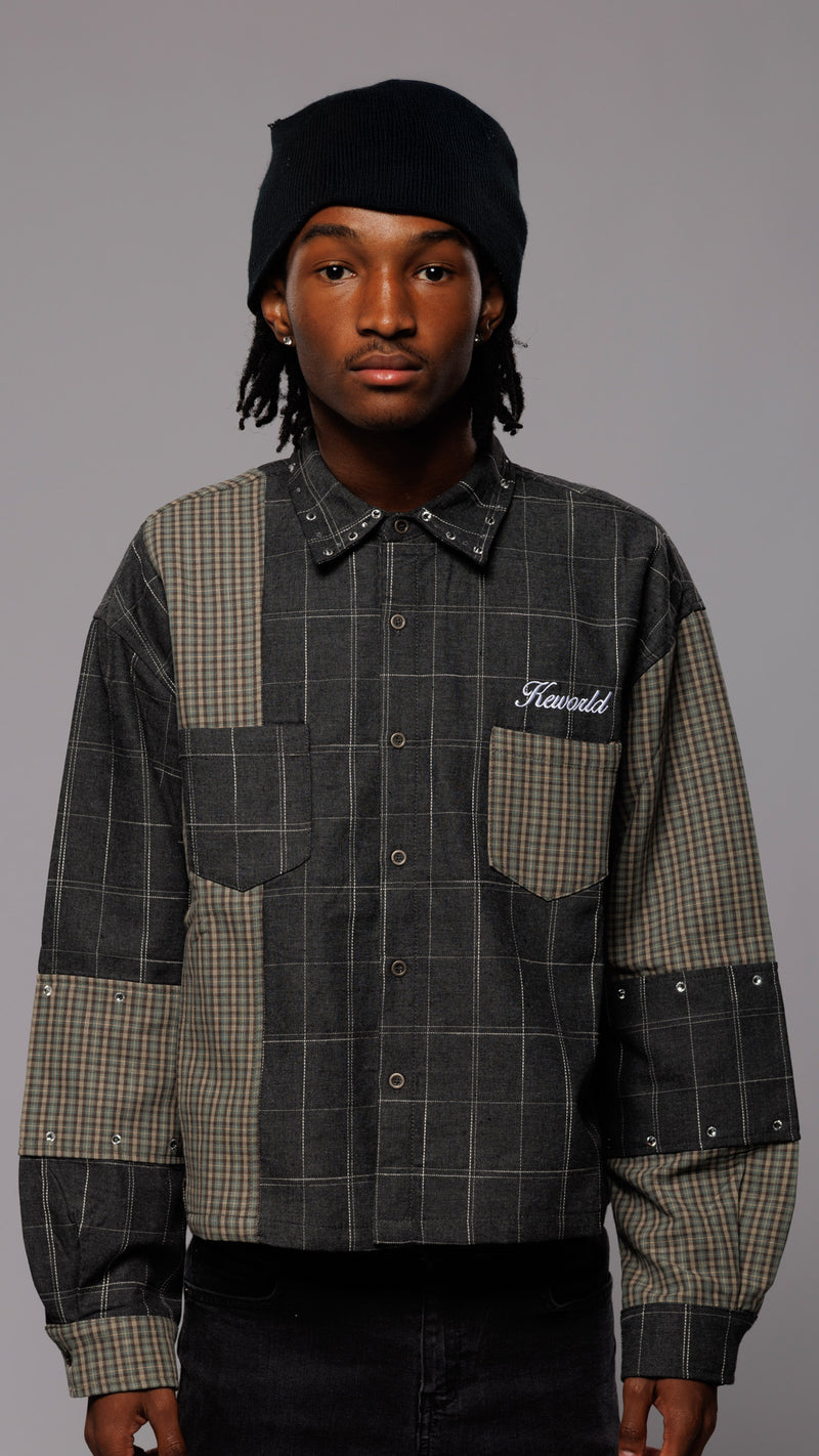 Person wearing a checkered shirt with 'Howard' branding on a gray background